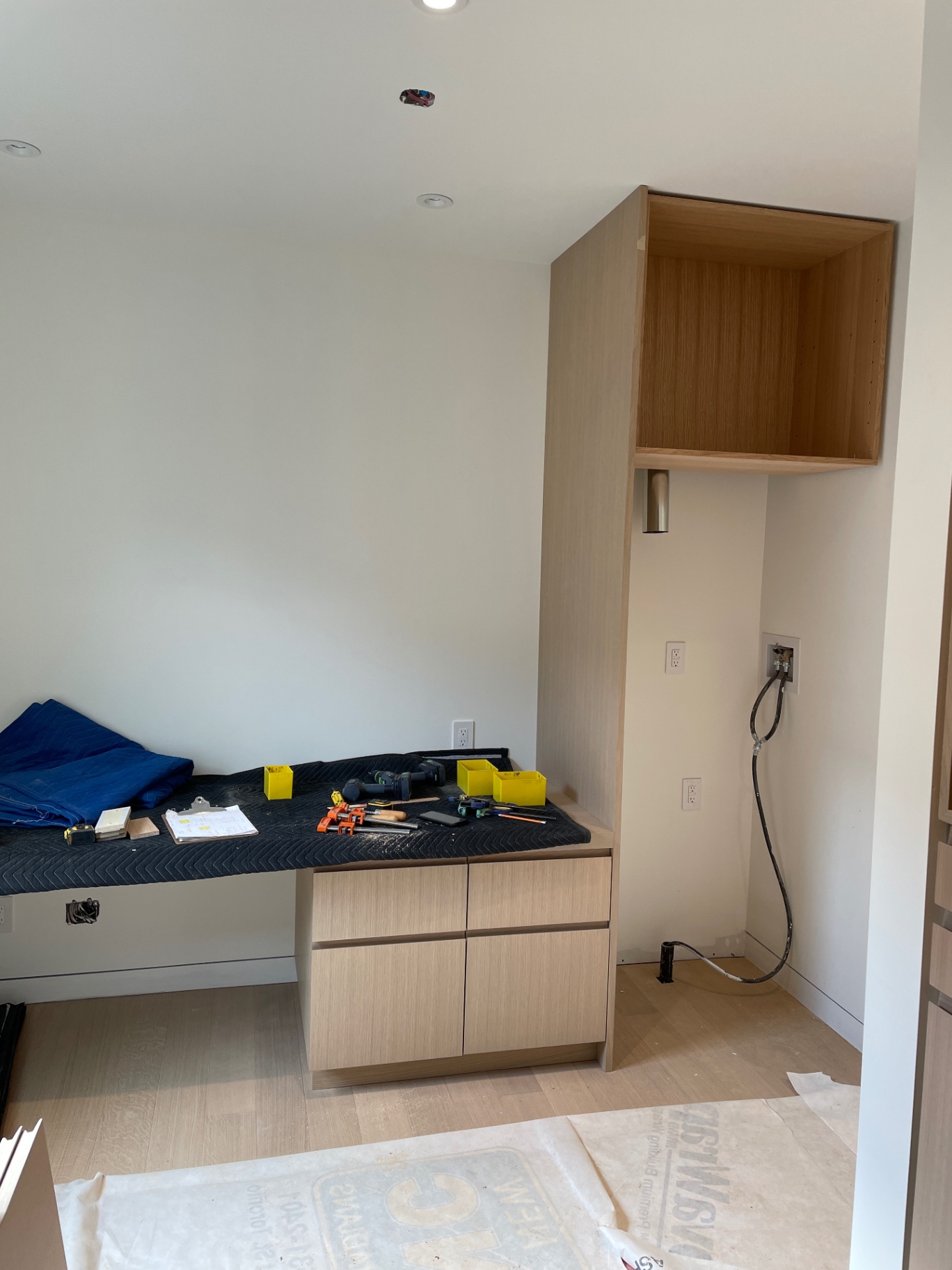 Vanity nook with tools out and upper cabinet pre-finish