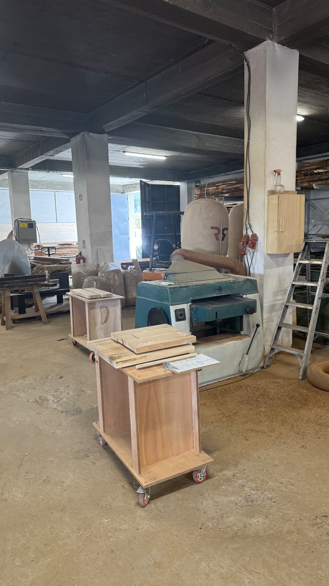 Timber racks and the thicknesser in the workshop