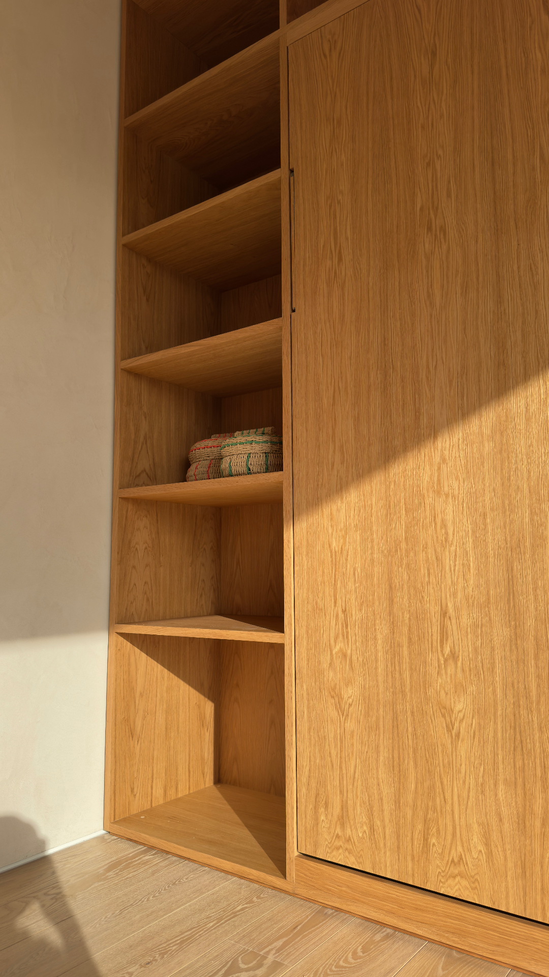 Right side of the oak shelving with concealed door reveal