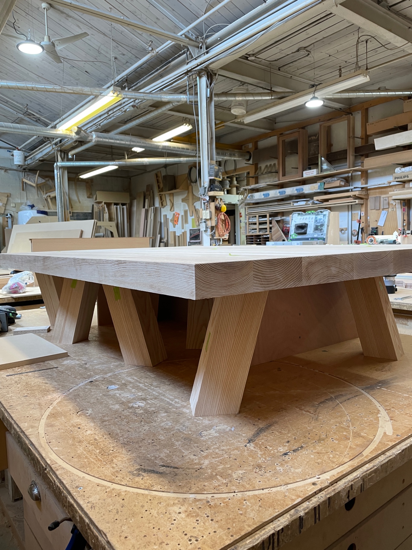 Side elevation of the ash coffee table showing the thick top and angled legs