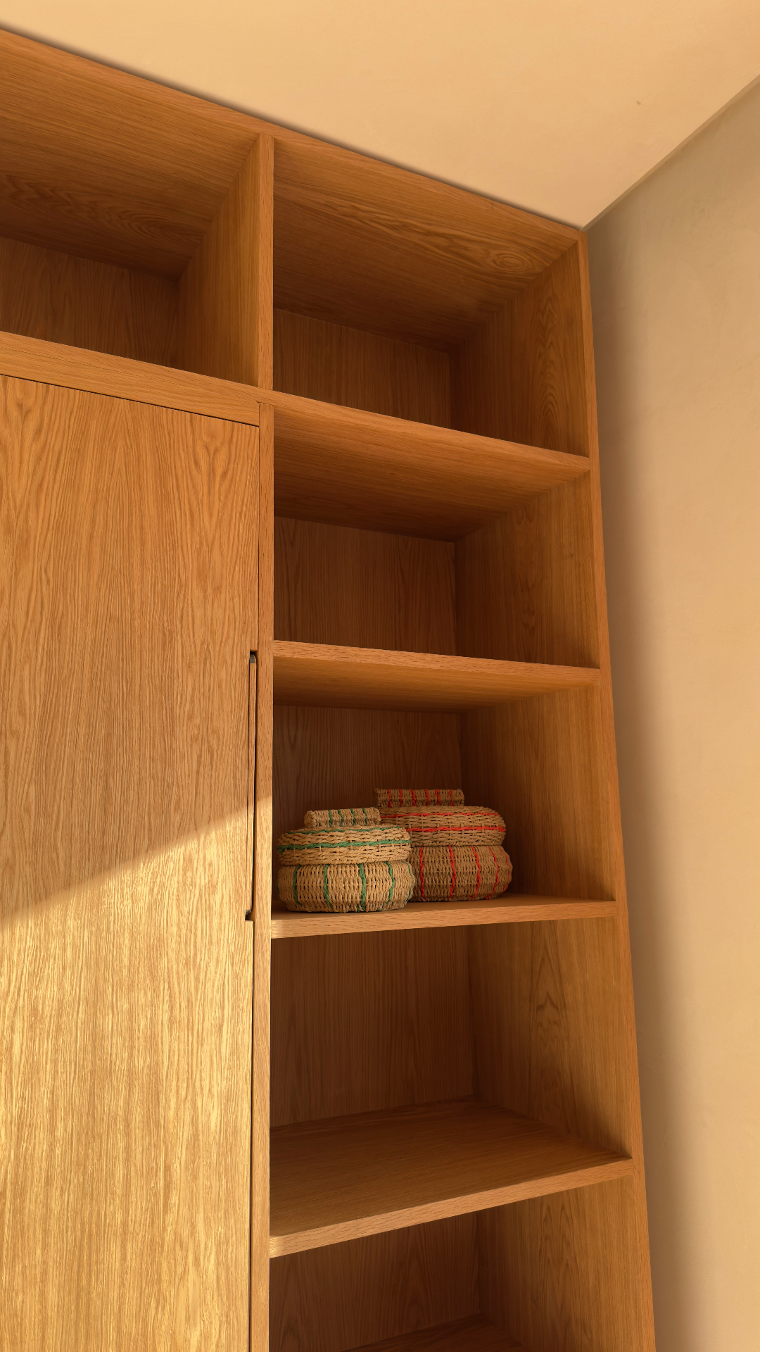 Close-up of oak shelves and flush cabinet door