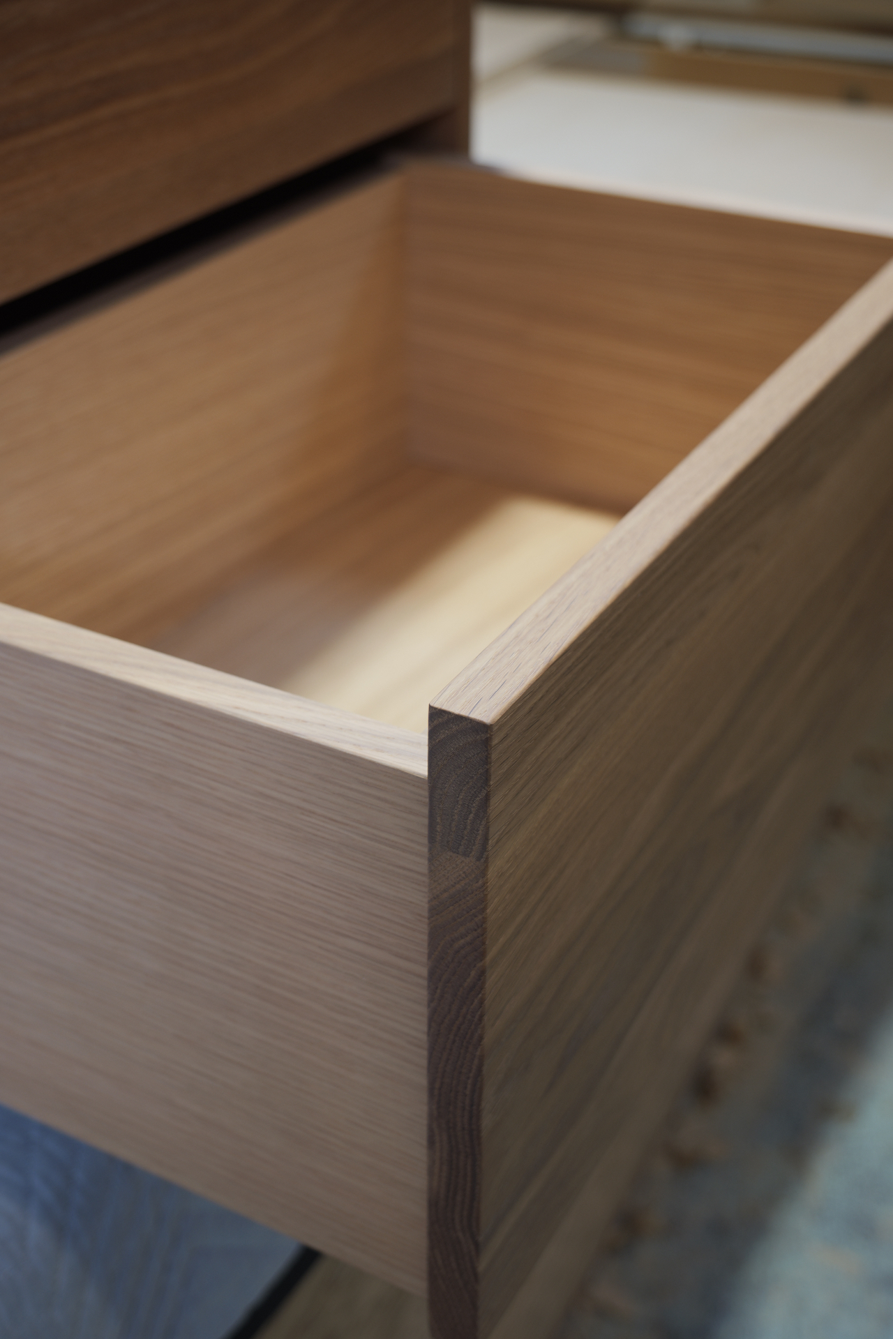 Solid oak drawer box detail with sycamore base