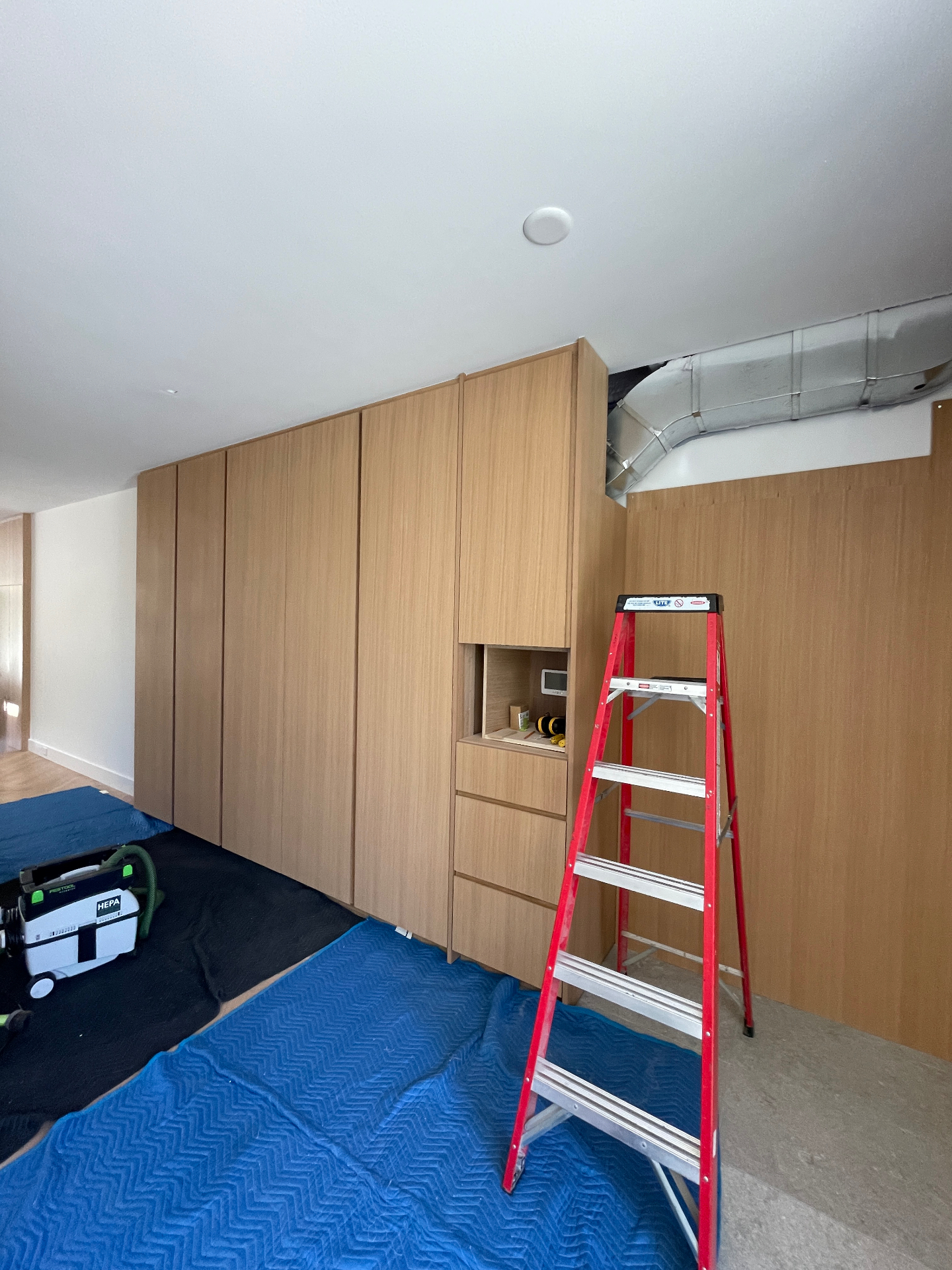 Detail of the drop-zone nook with drawers below and open cubby above