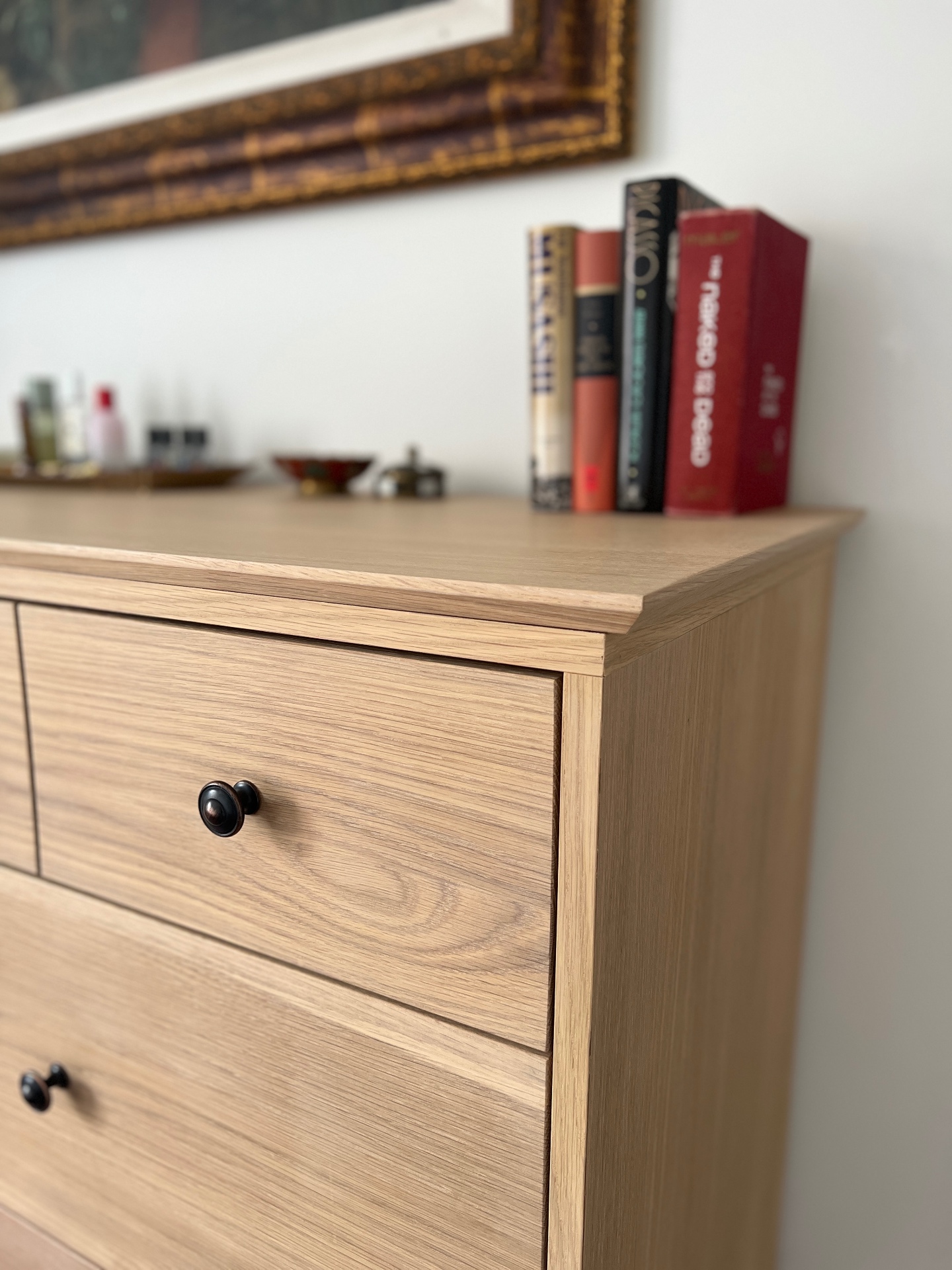 Close-up of oak grain, drawer reveal and bronze knob