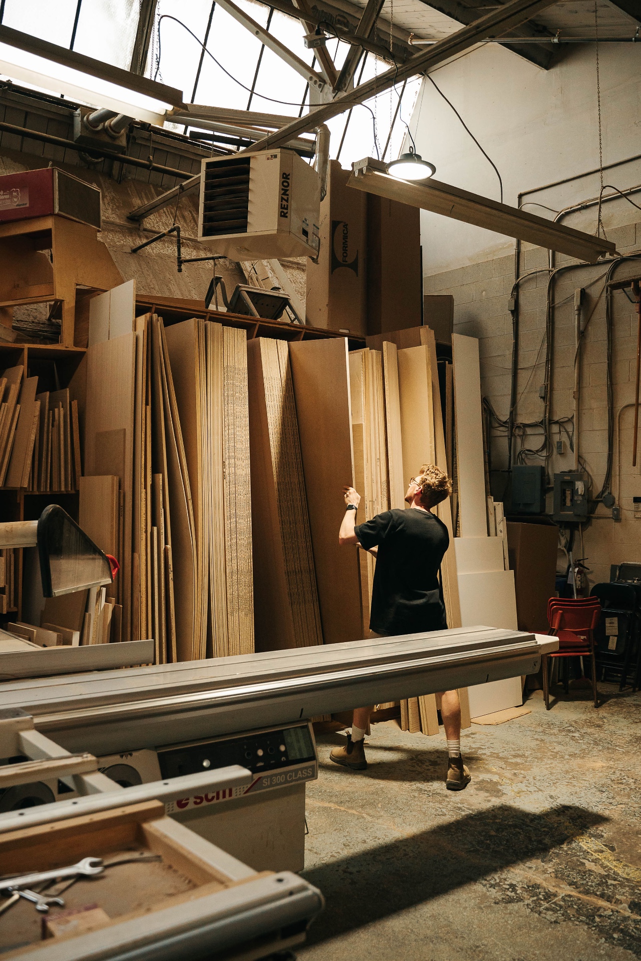 Martin shaping timber on a planer