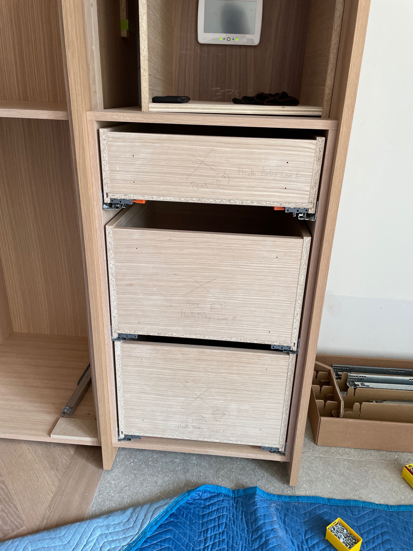 Bank of internal drawer carcasses with soft-close runners and chalk alignment marks