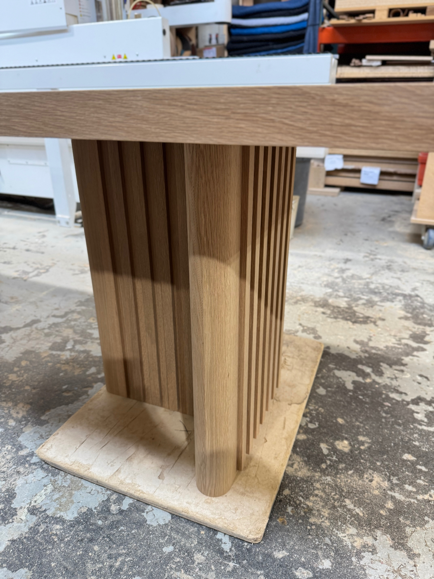 Full view of a fluted oak pedestal leg