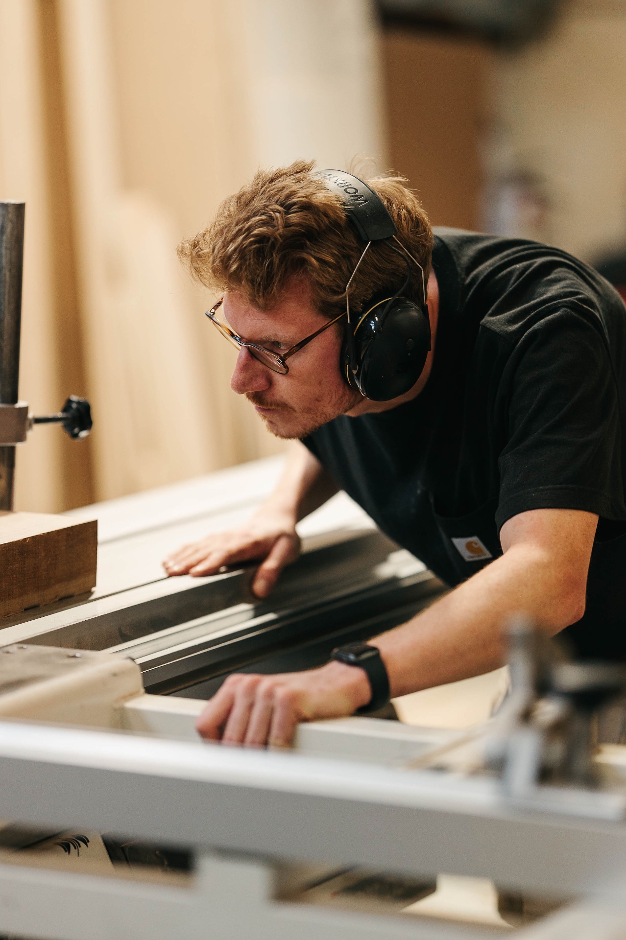 Martin shaping timber on a planer