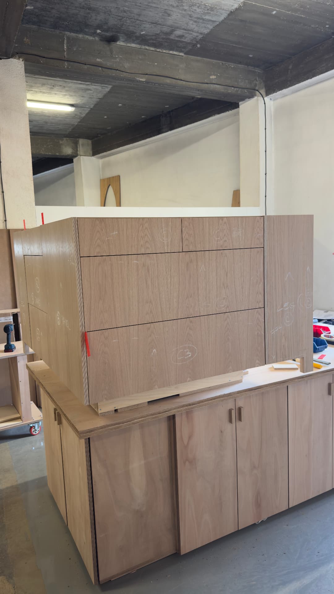 Bank of oak drawer fronts on a finished cabinet