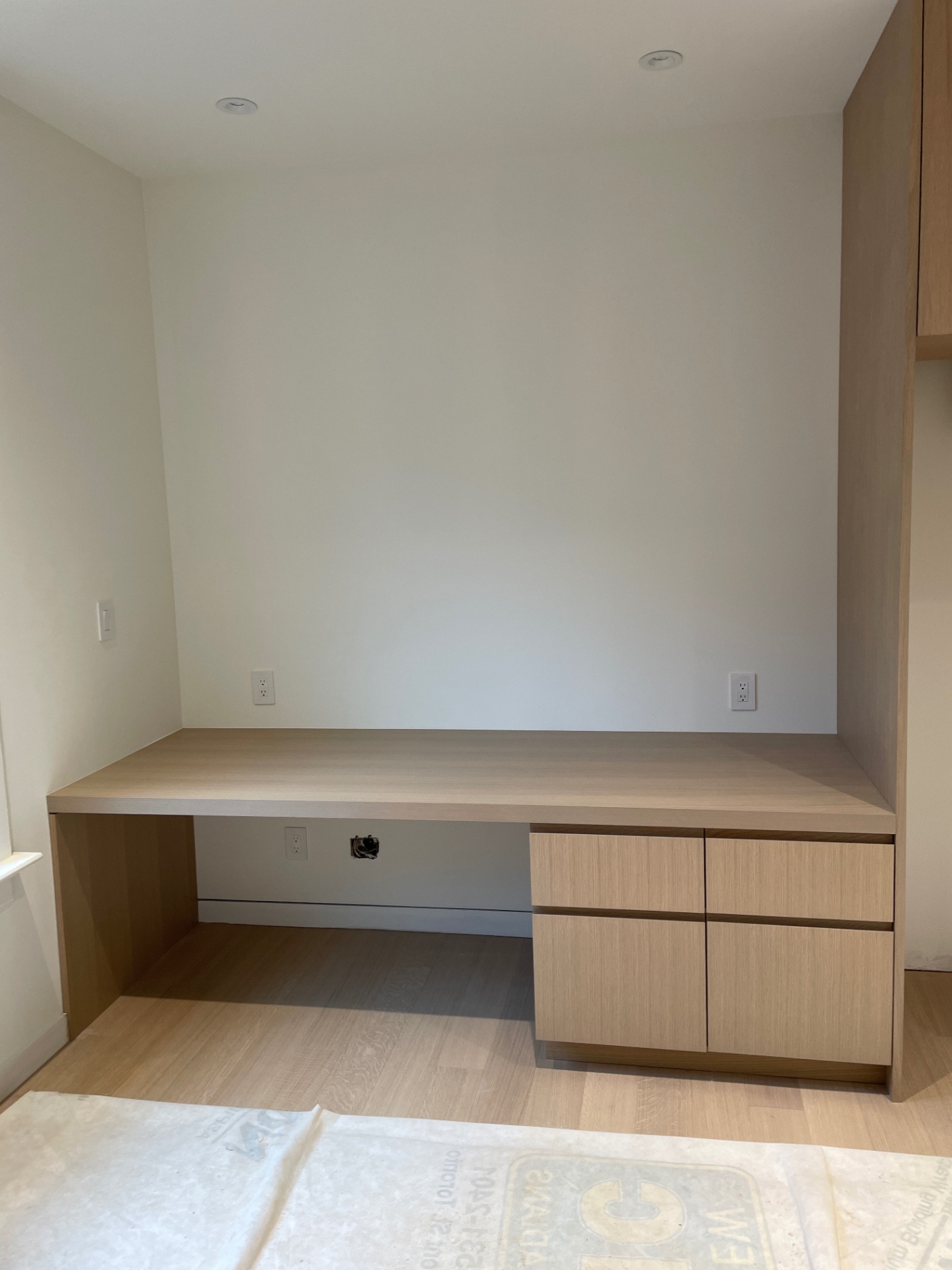 Finished oak vanity with floating top and twin drawer bank