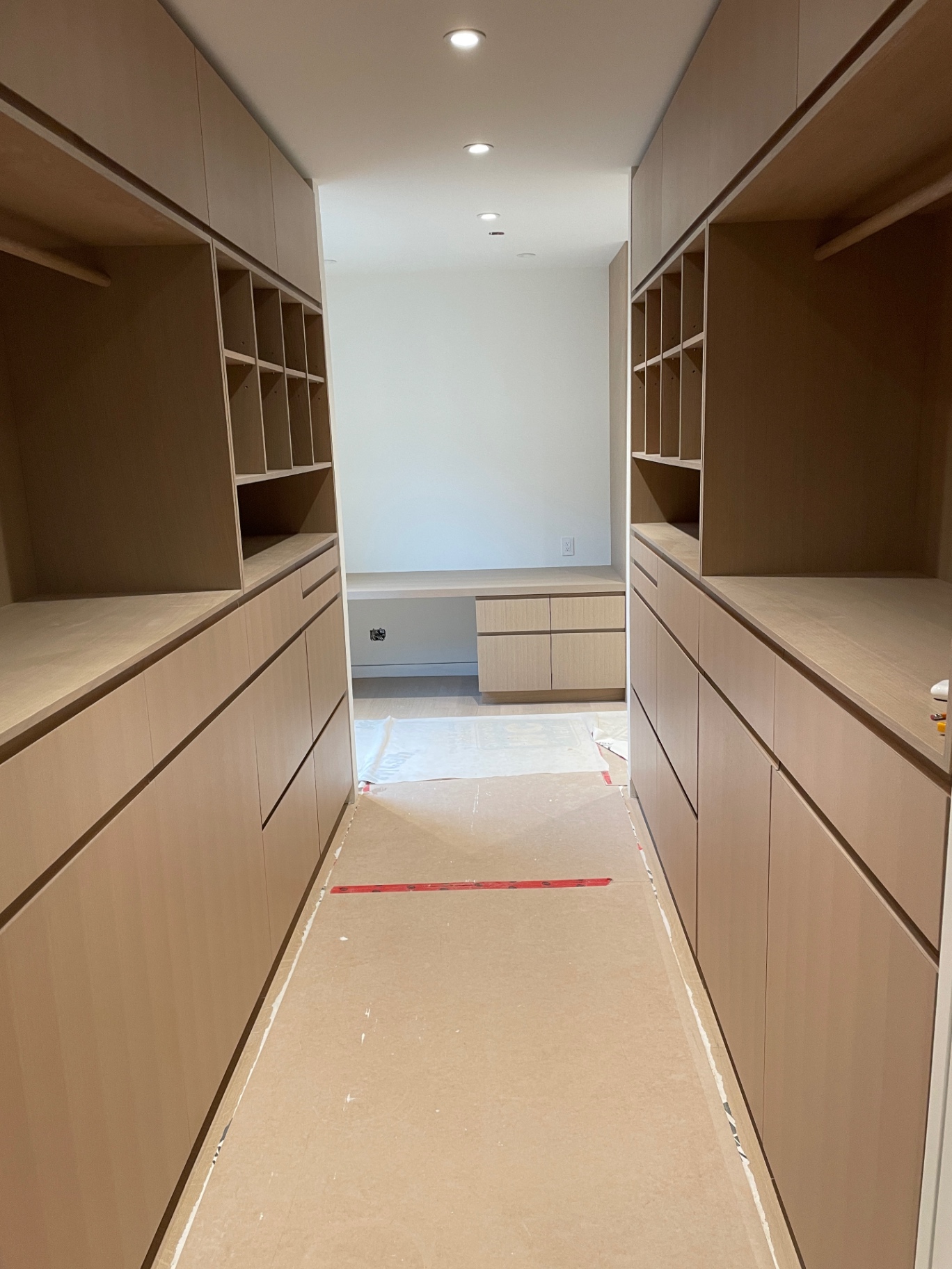 Closet near completion with drawer fronts and cubbies installed