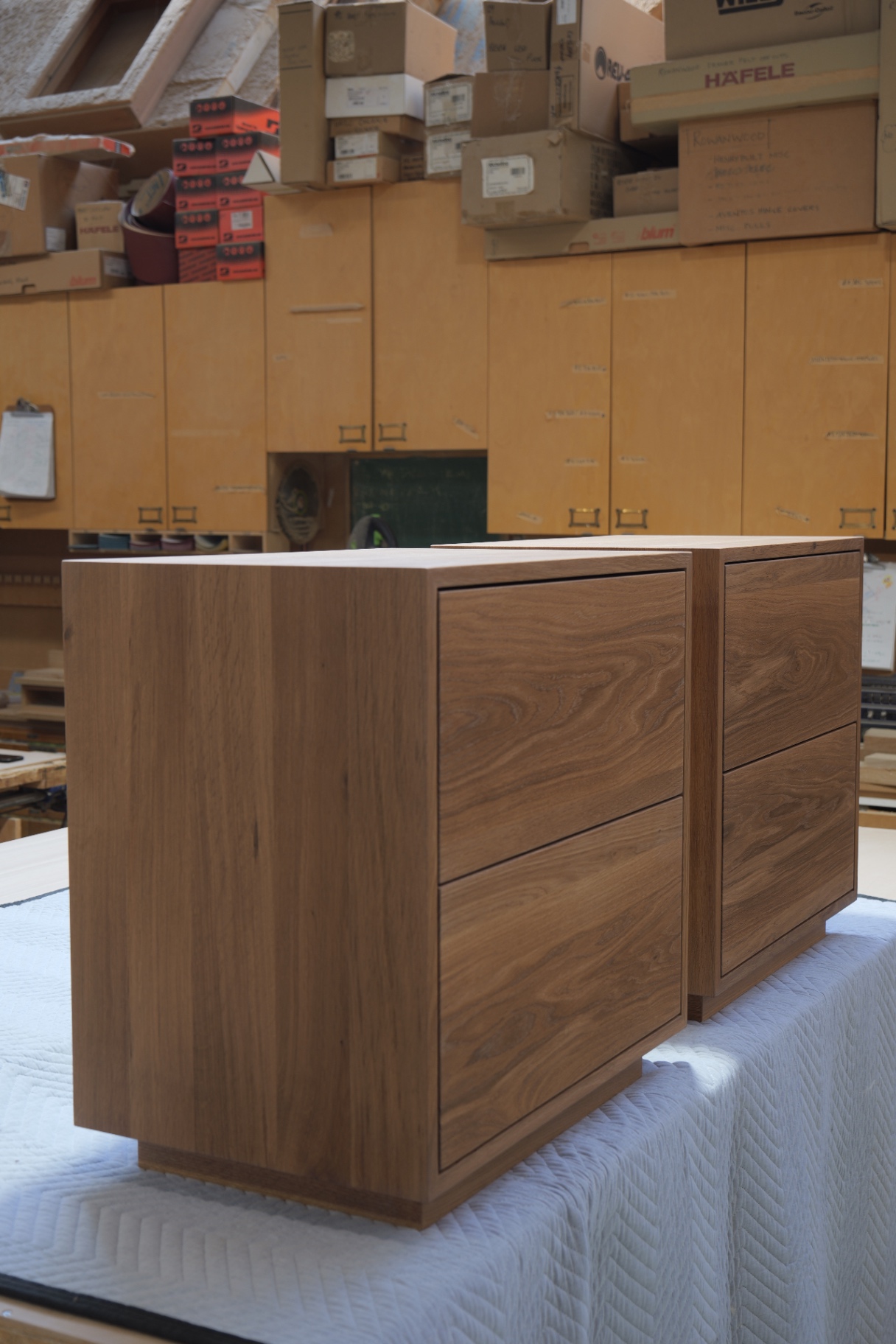 Side view of the pair showing the recessed plinth