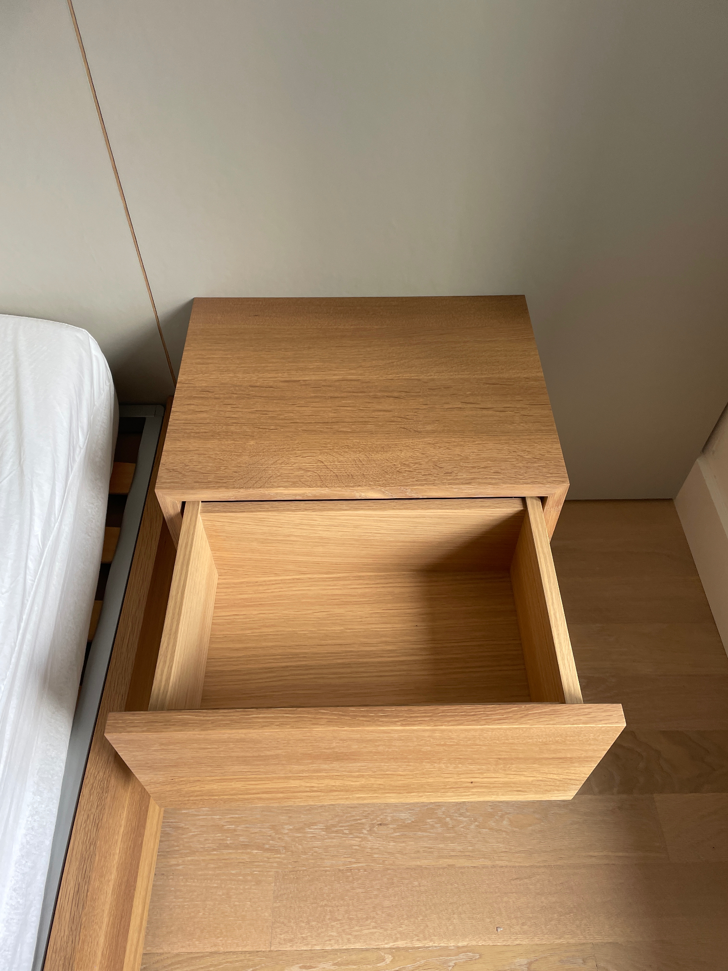 Open drawer detail of the oak floating nightstand