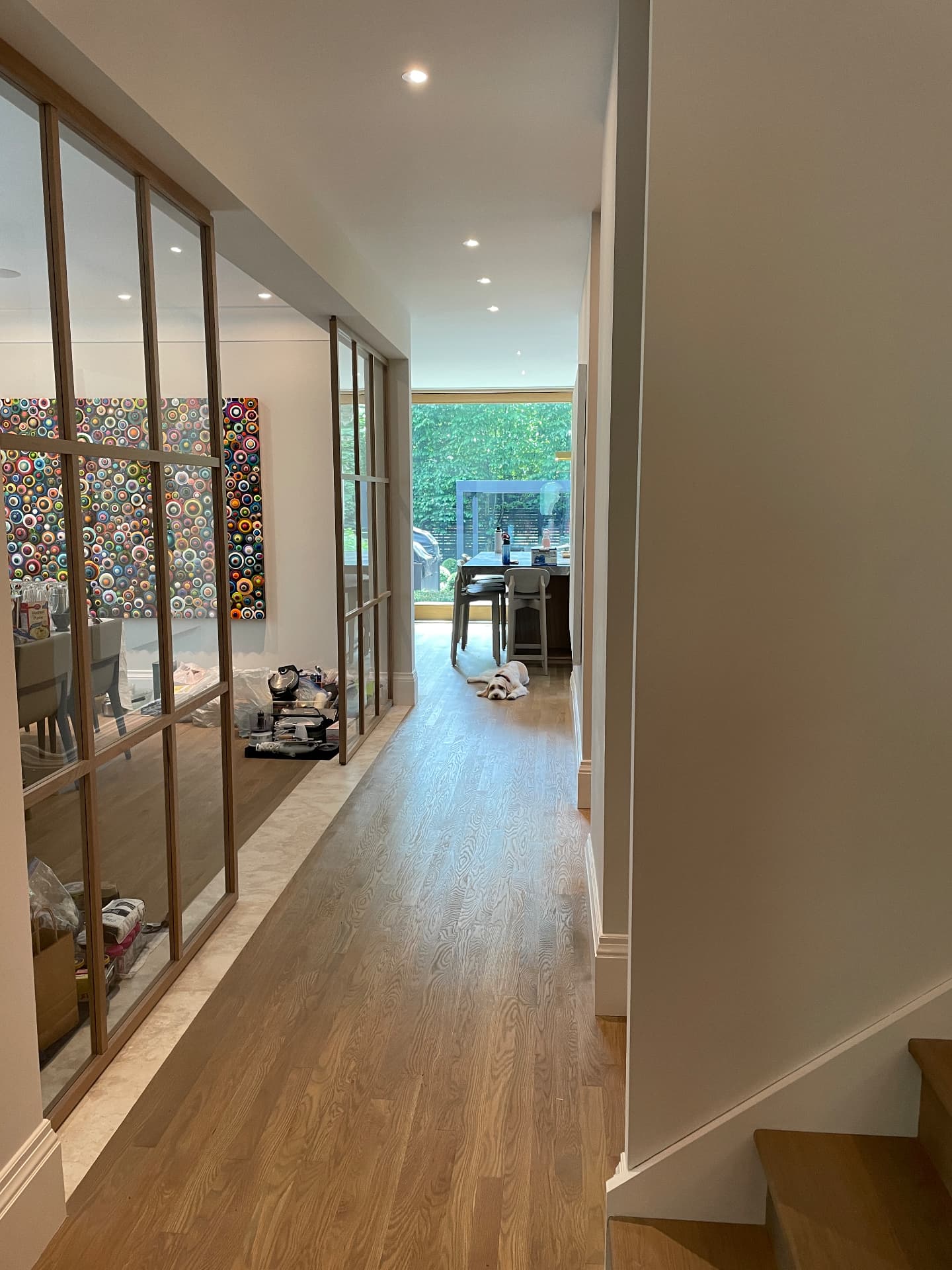 Hallway view along the oak-framed glazed partitions towards the kitchen