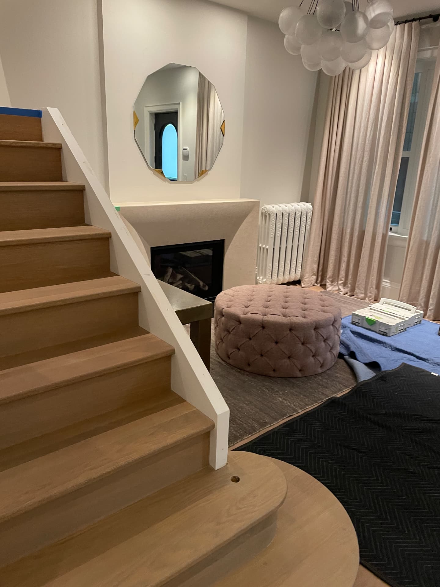 Oak staircase treads and living room during the renovation