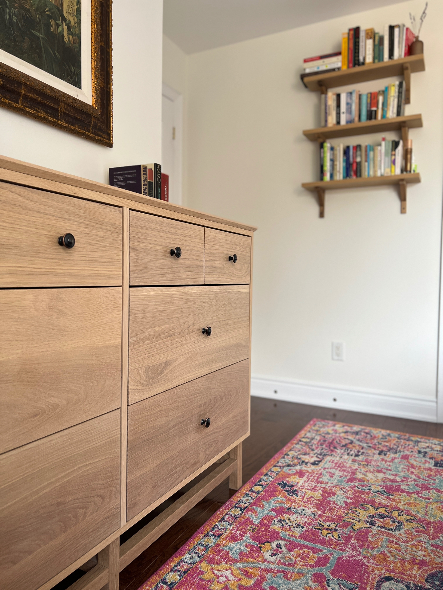 Oak dresser drawers and knobs in raking light