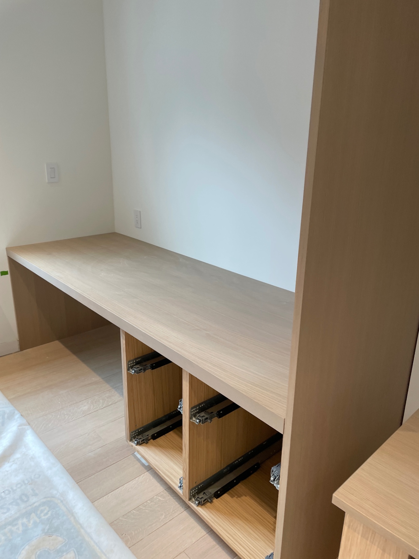 Vanity top installed with drawer slides exposed underneath