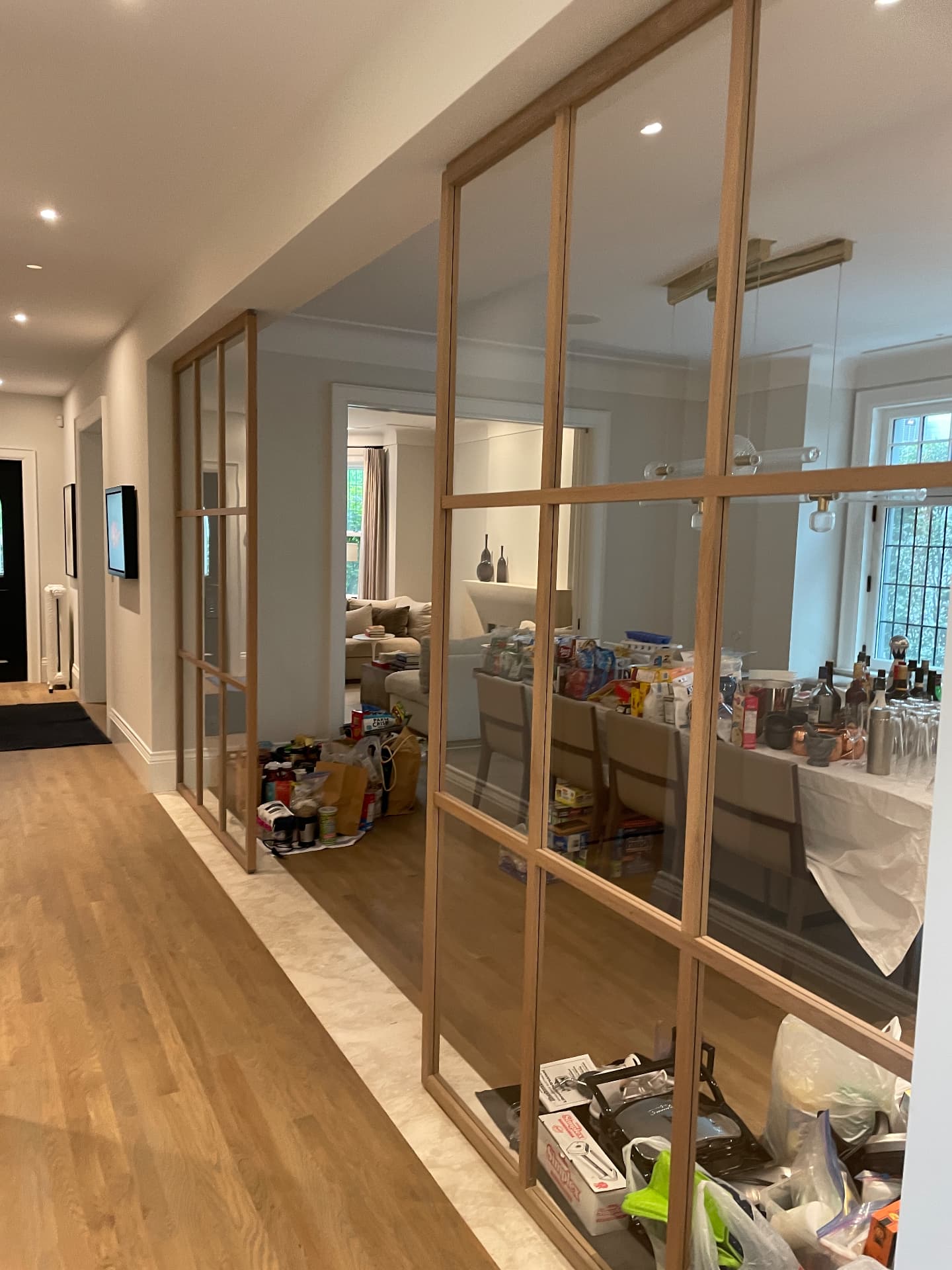 Oak-framed glazed partition separating the hallway from the dining room