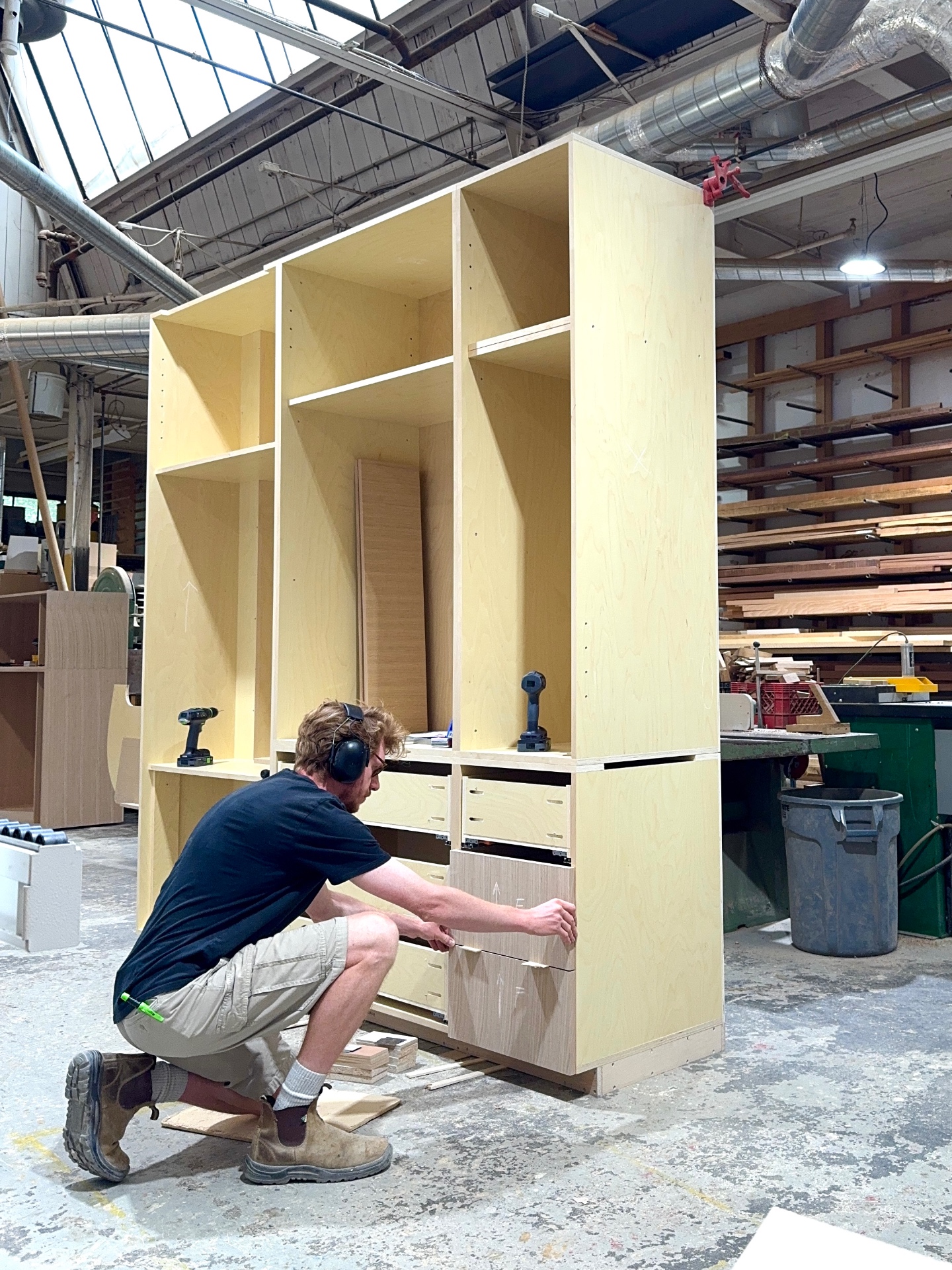 Birch plywood carcasses of the closet with drawers fitted before doors go on
