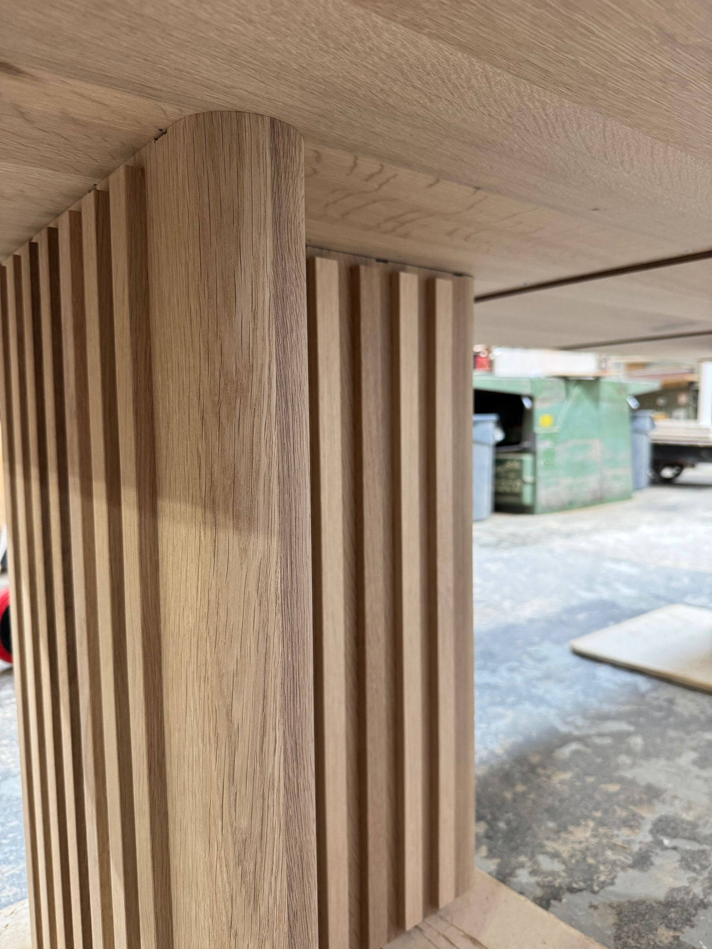 Close-up of vertical fluting on the oak leg