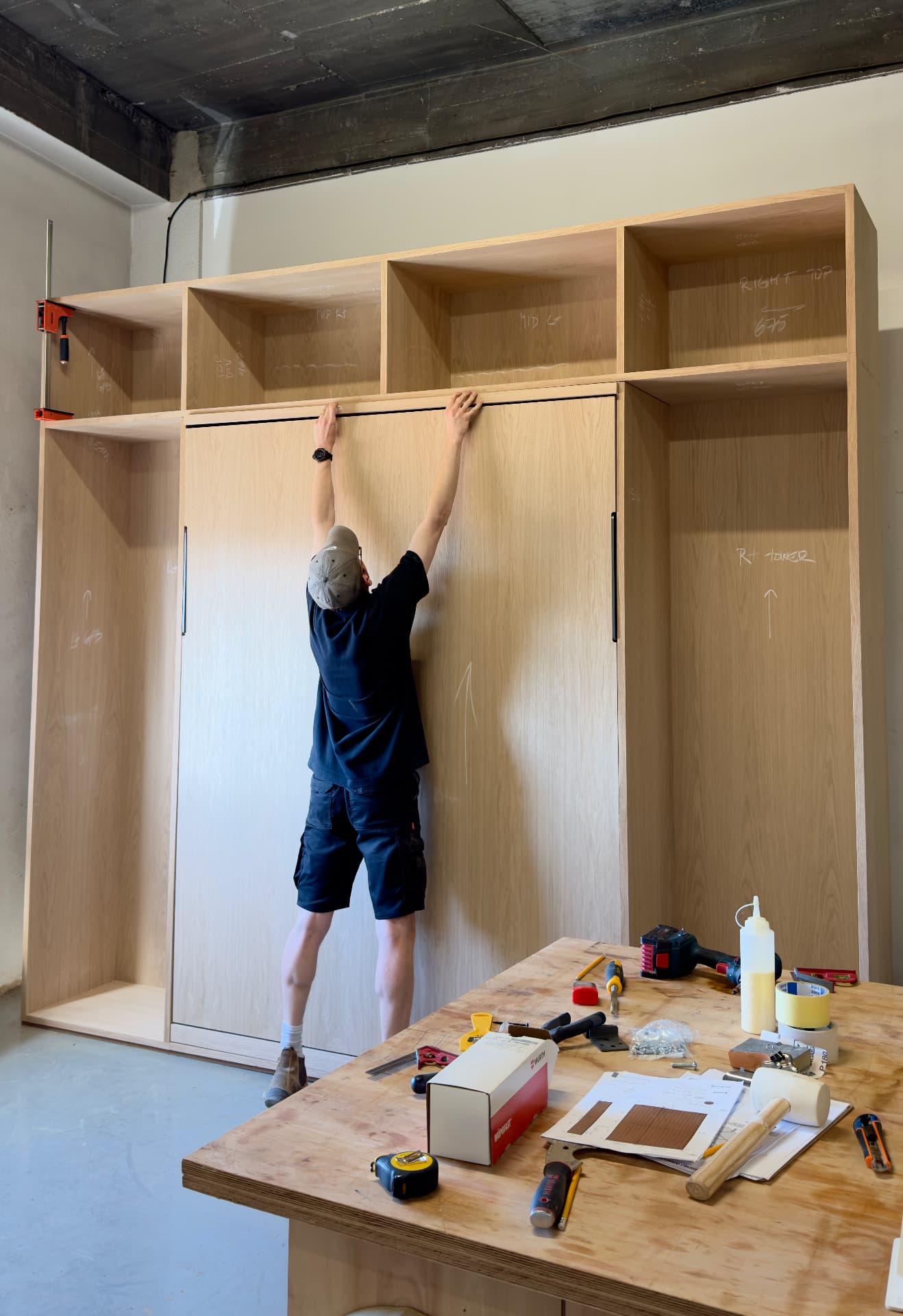 Hanging sliding oak doors on a fitted wardrobe