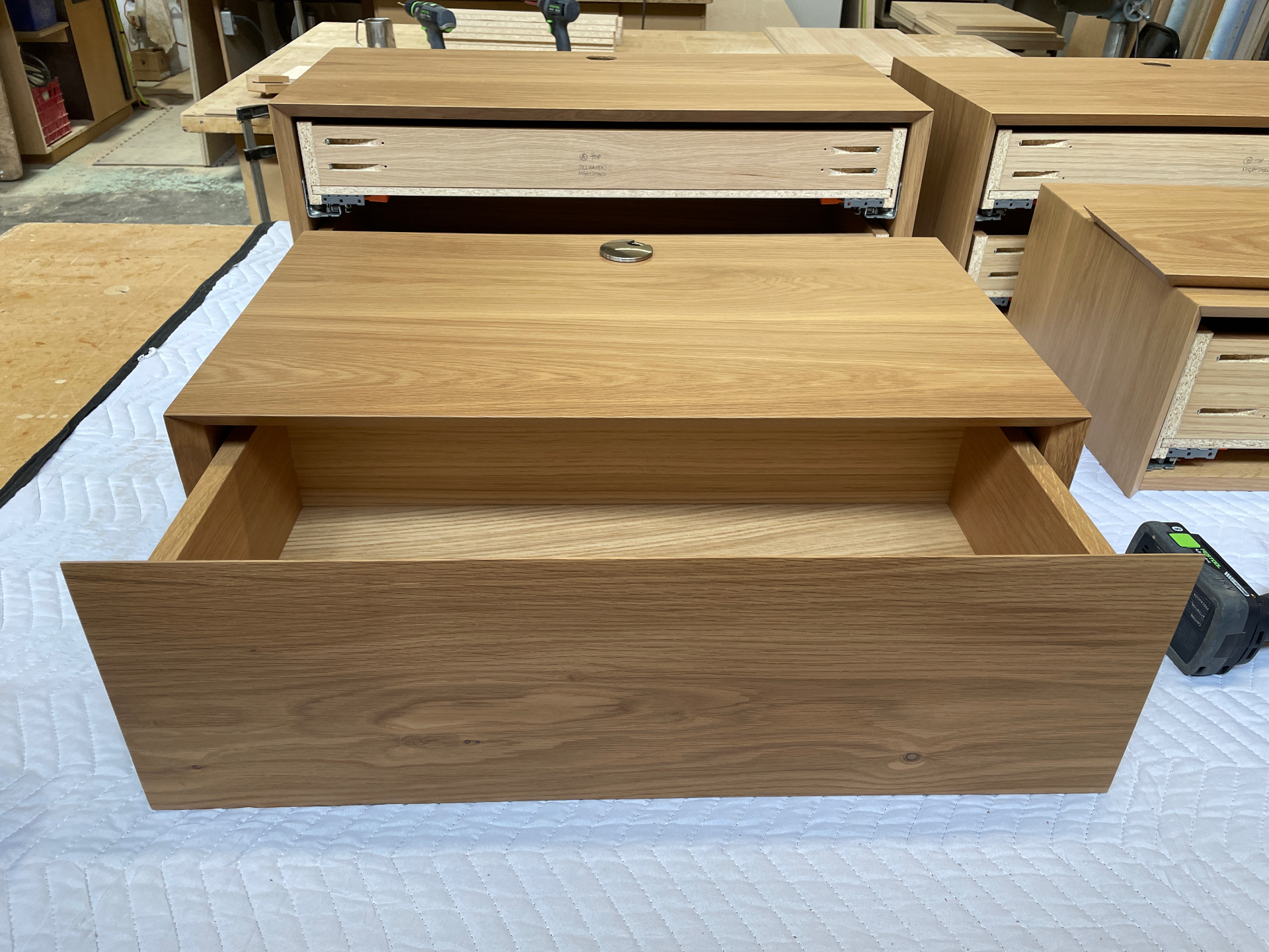 Floating nightstand with the drawer removed, showing the interior cavity and hardware