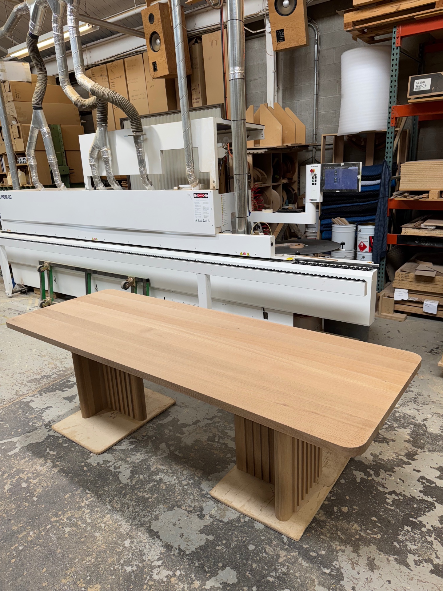 Three-quarter view of the oak dining table