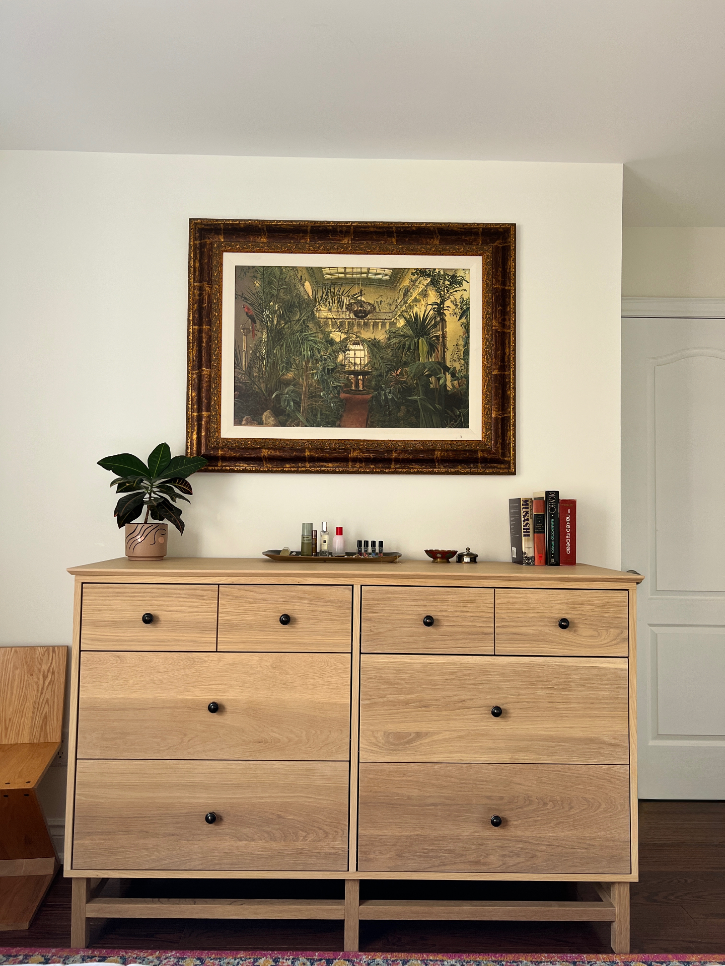 Oak dresser styled under a framed painting