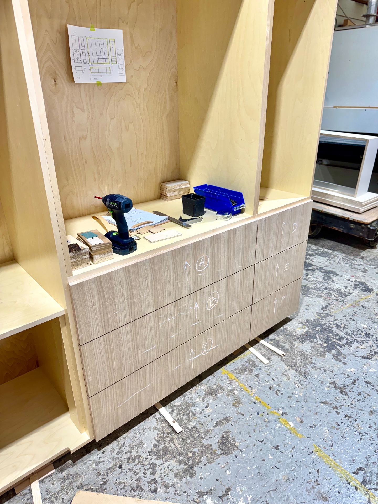 Detail of the drawer bank with oak-veneer faces marked for orientation