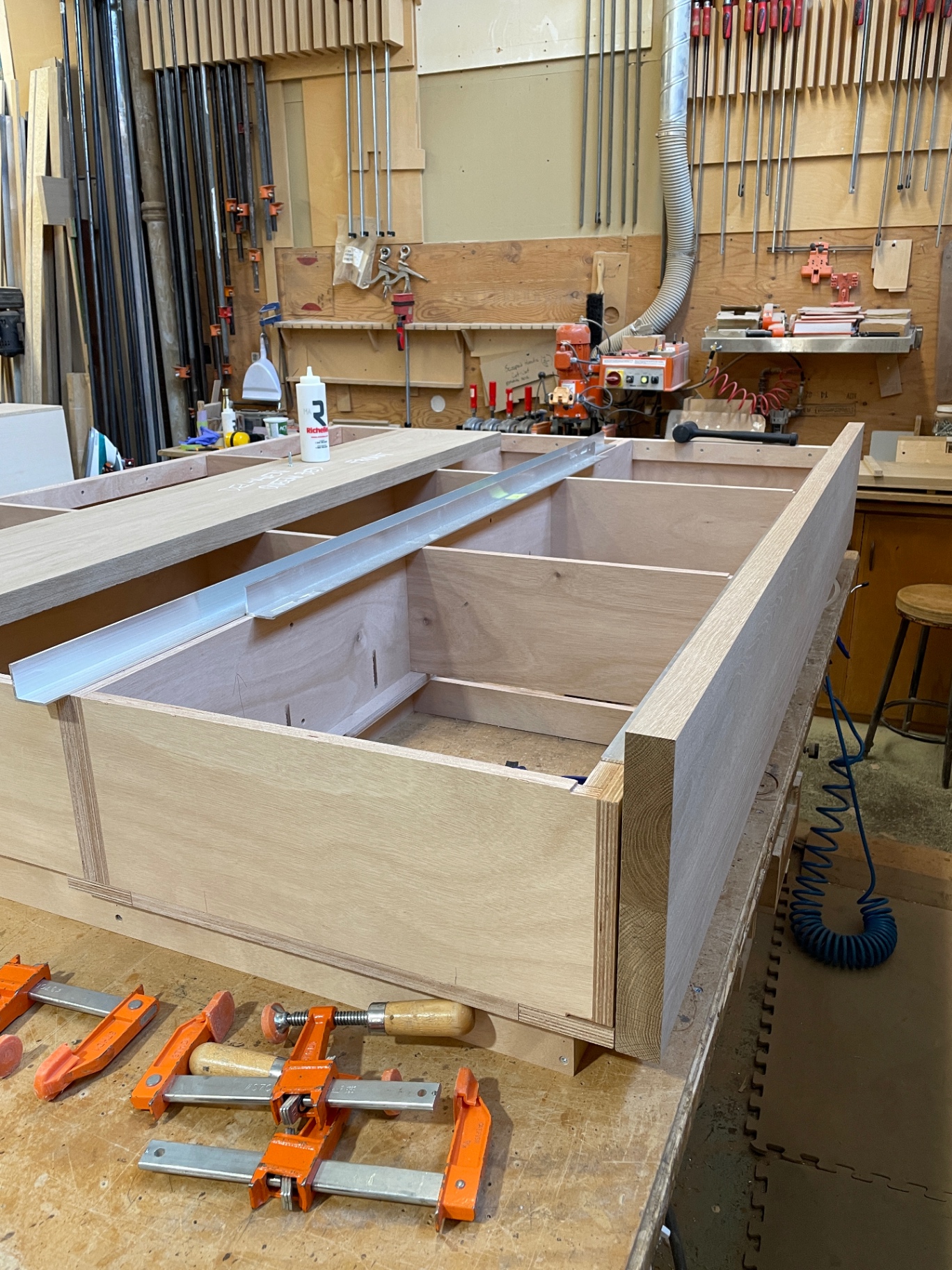 Under-bed oak storage carcass with divided bays under construction