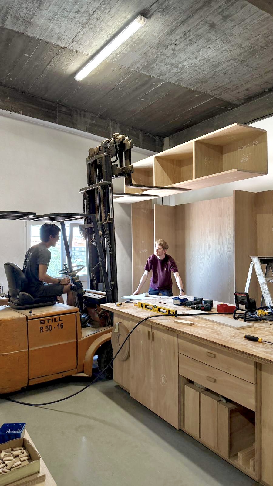 Lifting oak wall units into position during installation