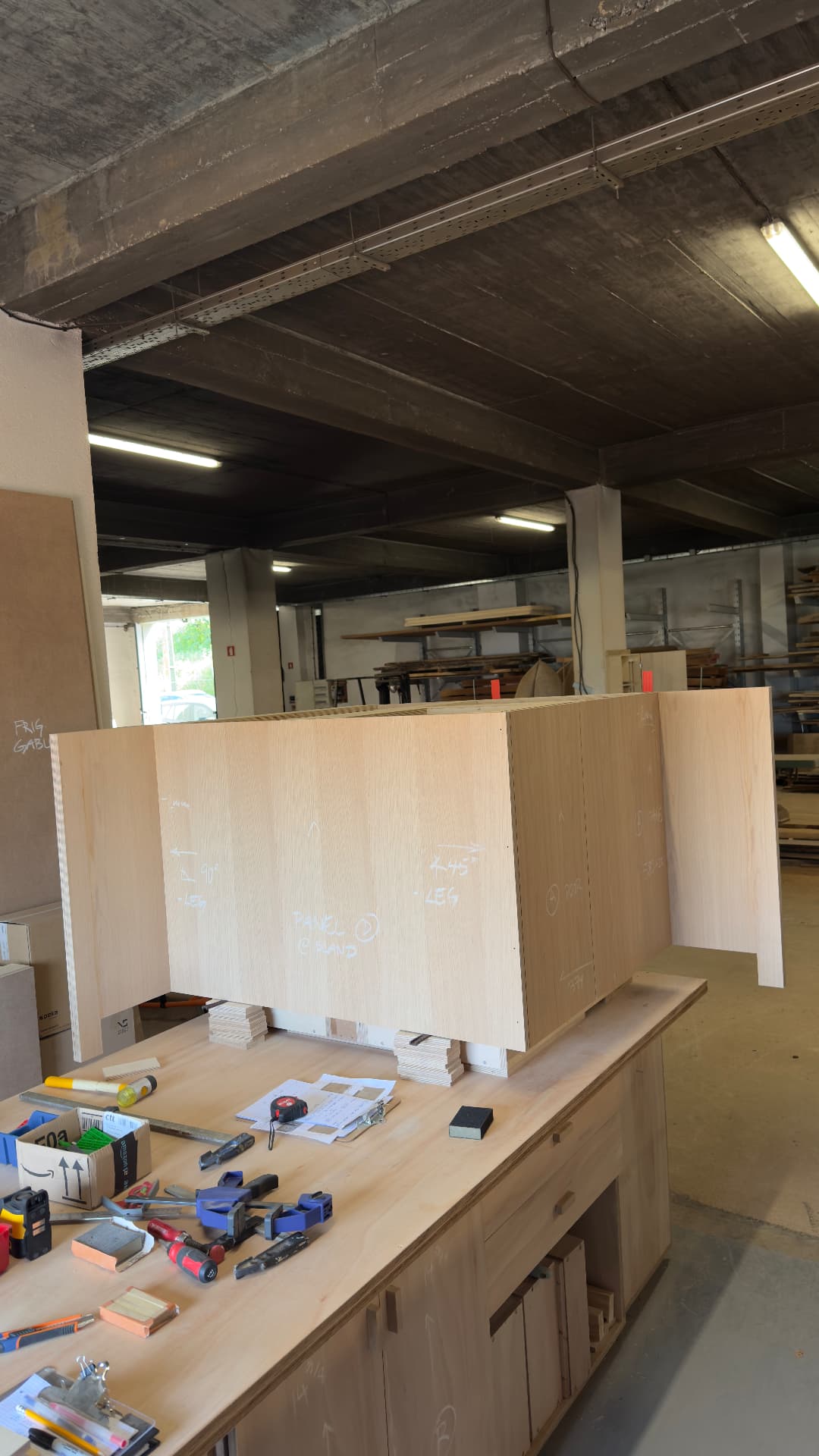 Oak kitchen panels dry-fitted on the bench