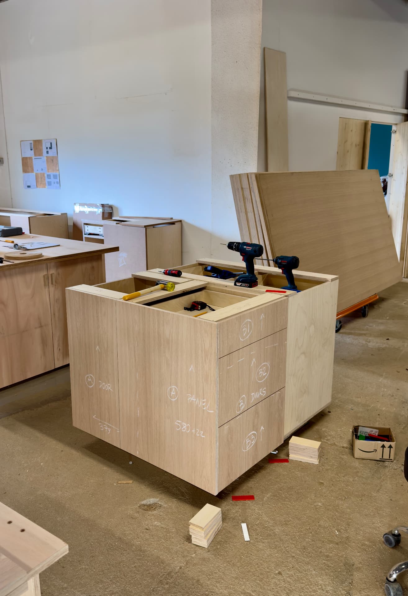 Kitchen island boxes being screwed together